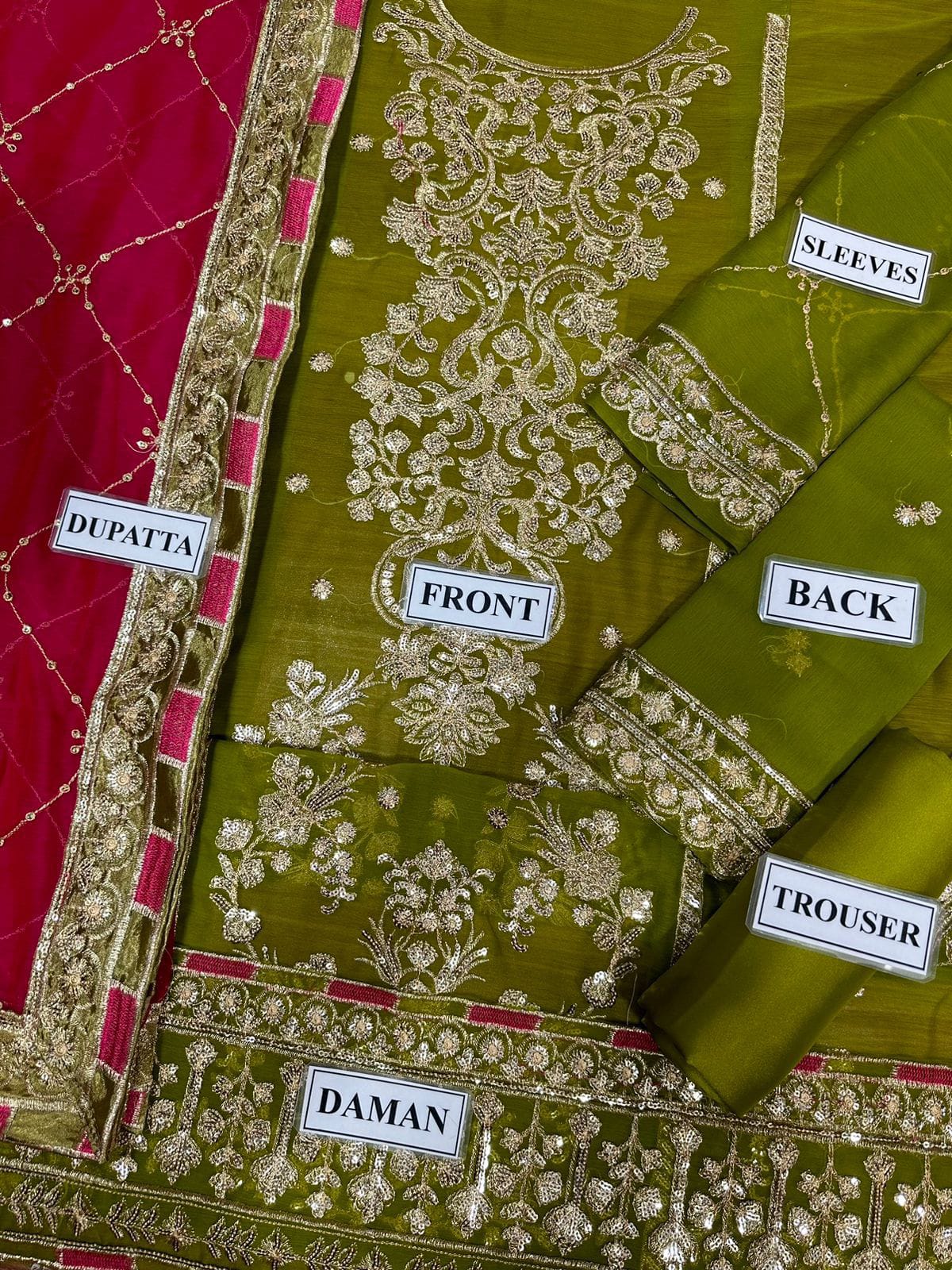 Suit flat lay - front, back, sleeves, dupatta, trouser, daman