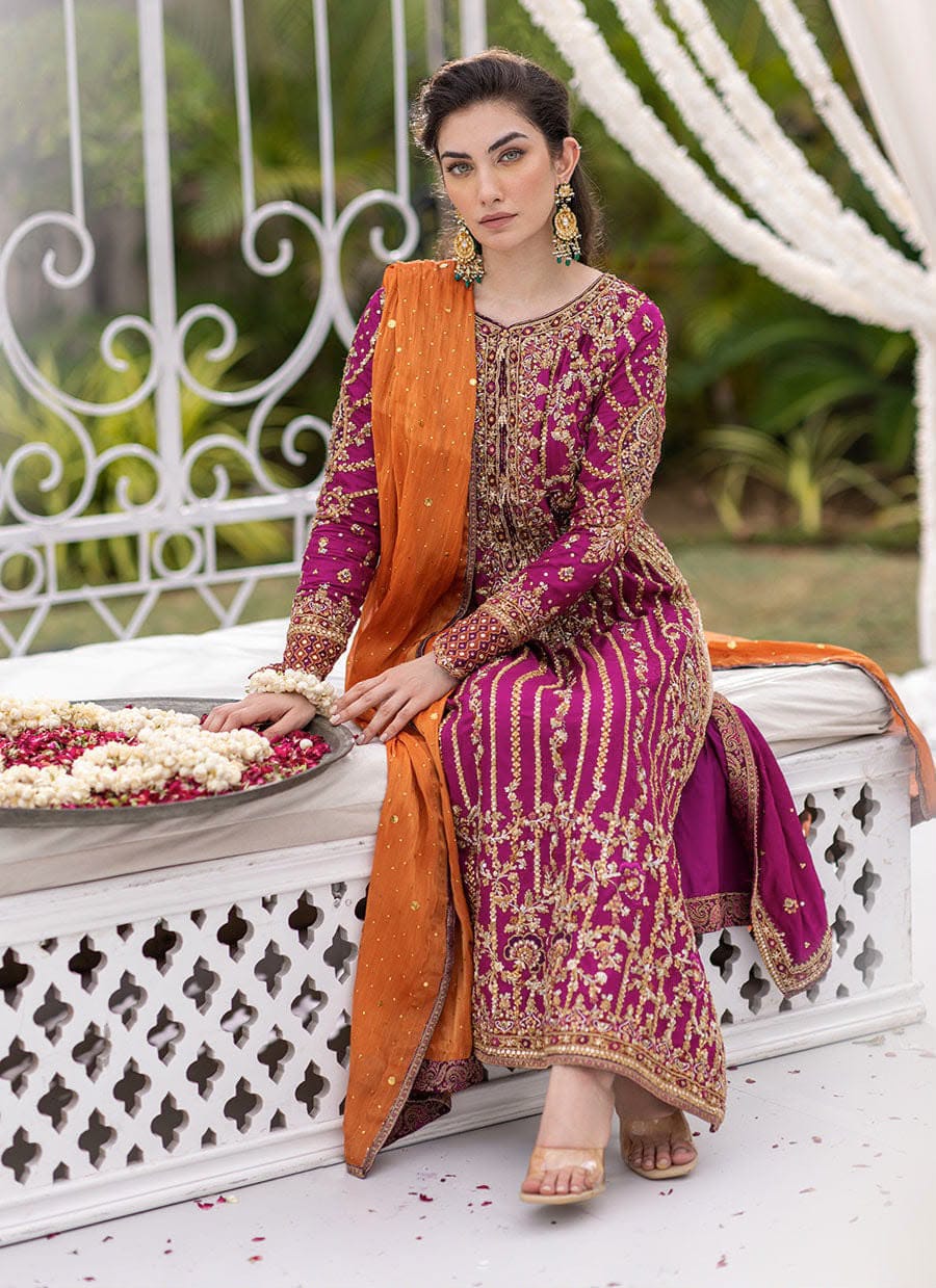 Magenta handwork chiffon suit with orange dupatta - model seated front view